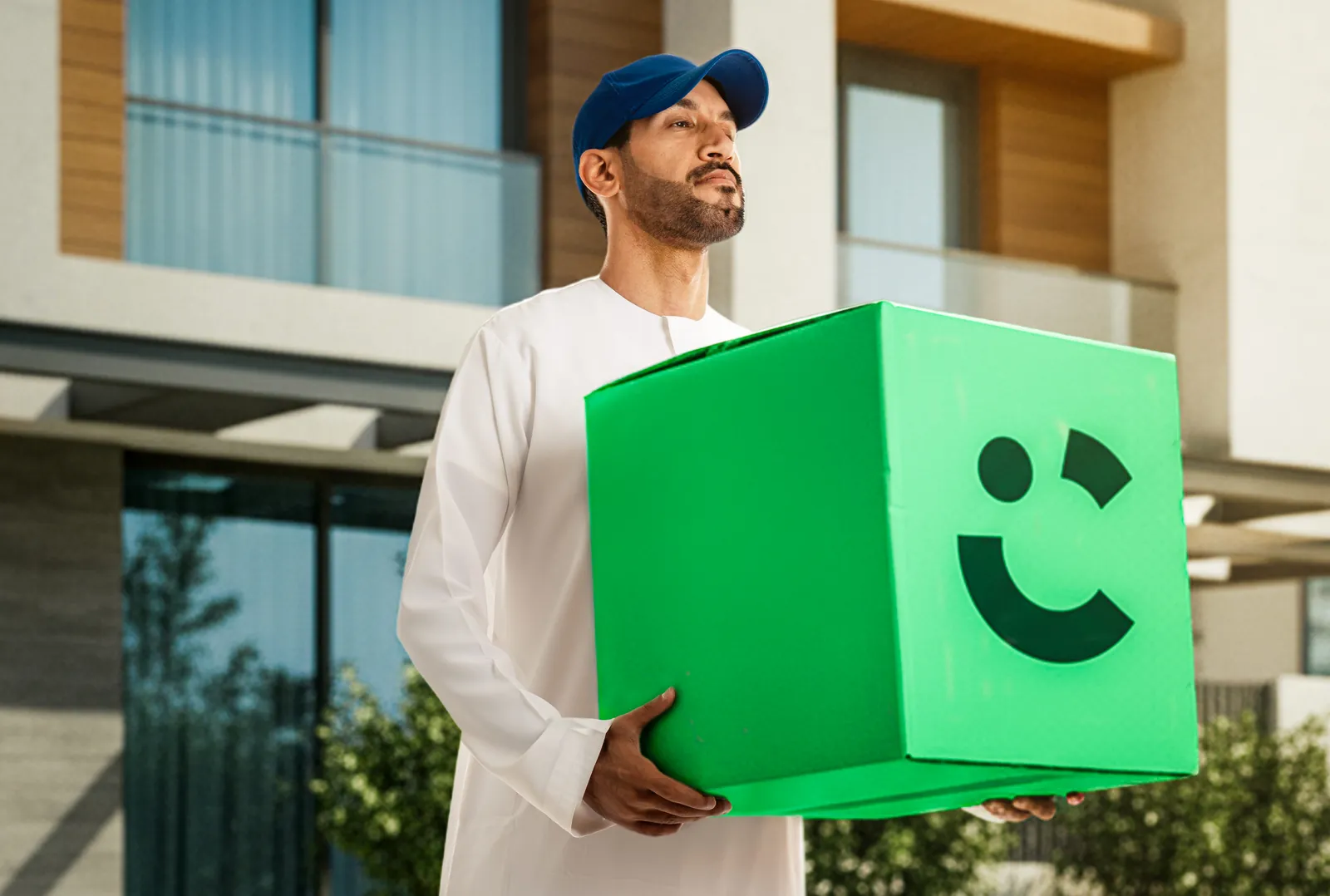Same shot after AI: the box becomes a branded delivery box and the set moves outdoors