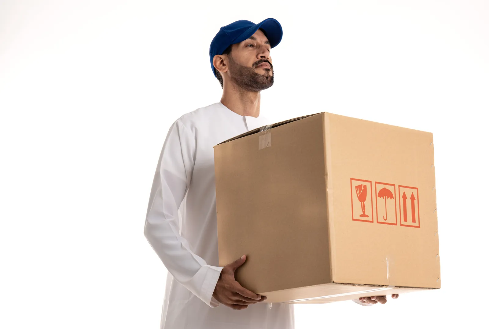 Real photo: man in kandura holding a plain cardboard box