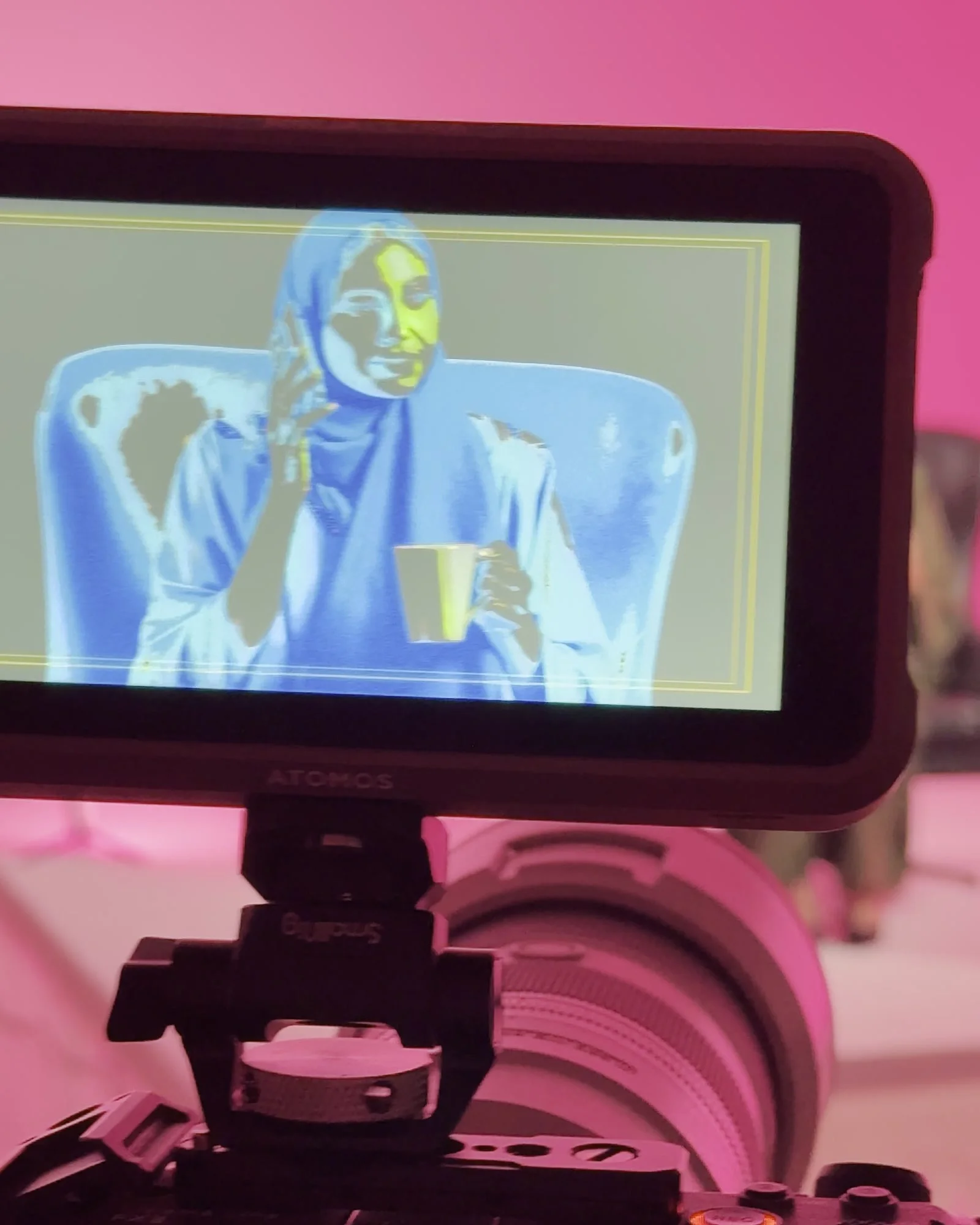 Cinema camera and monitor framing the talent on a studio set
